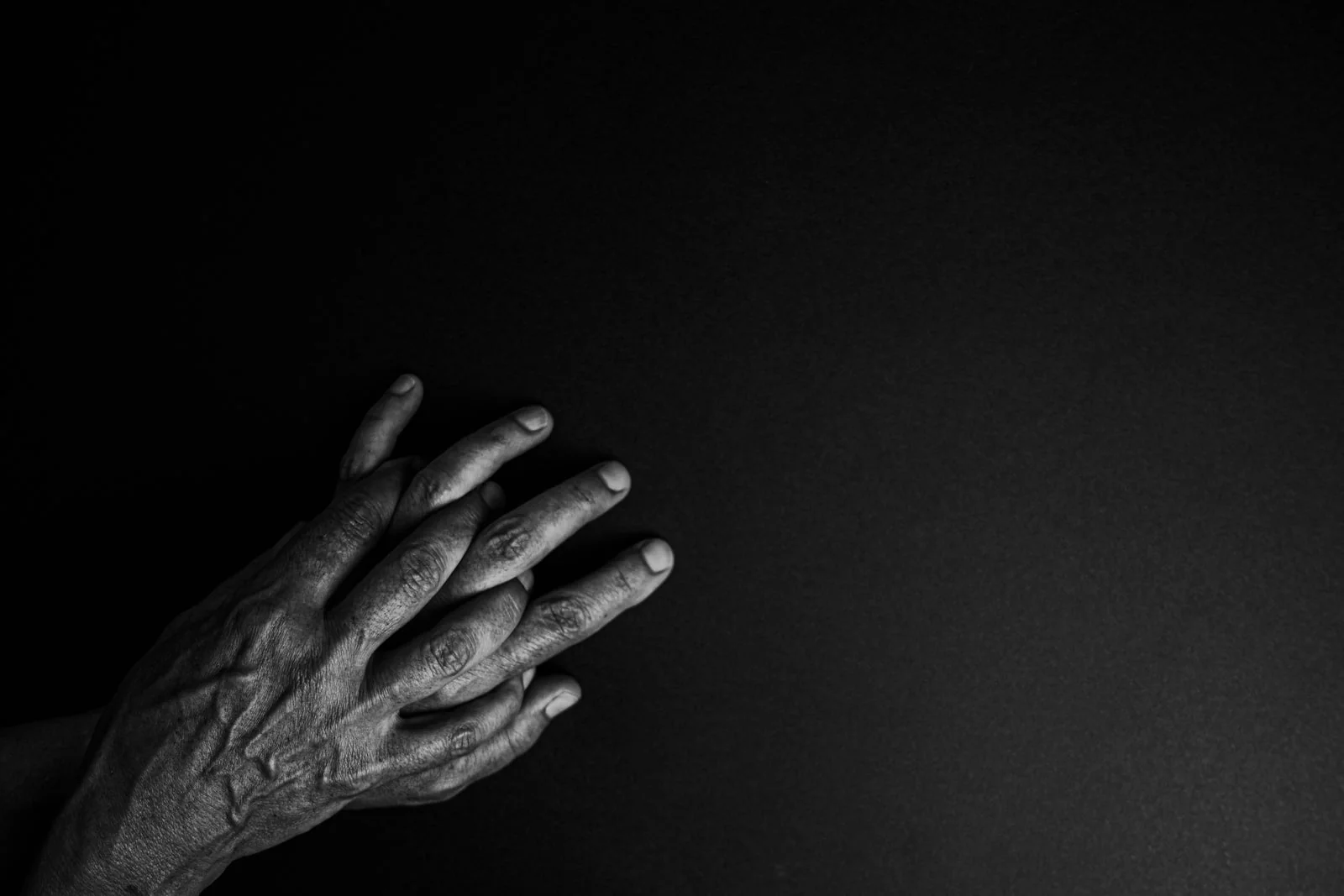 Two hands resting on each other