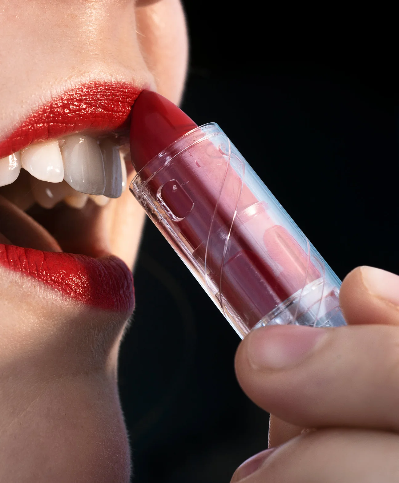 A person applying lip colour